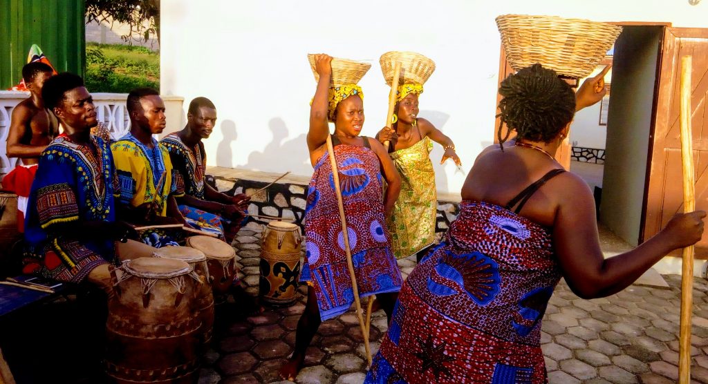 Tsirkormpam Dance Theatre - lady carrying basket during a cultural performance